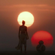 Rey and BB-8 look at the binary sunset at the end of Star Wars: The Rise of Skywalker.